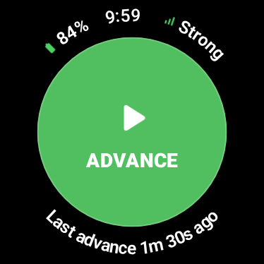 Wear OS watch showing battery, signal, and a large green ADVANCE button